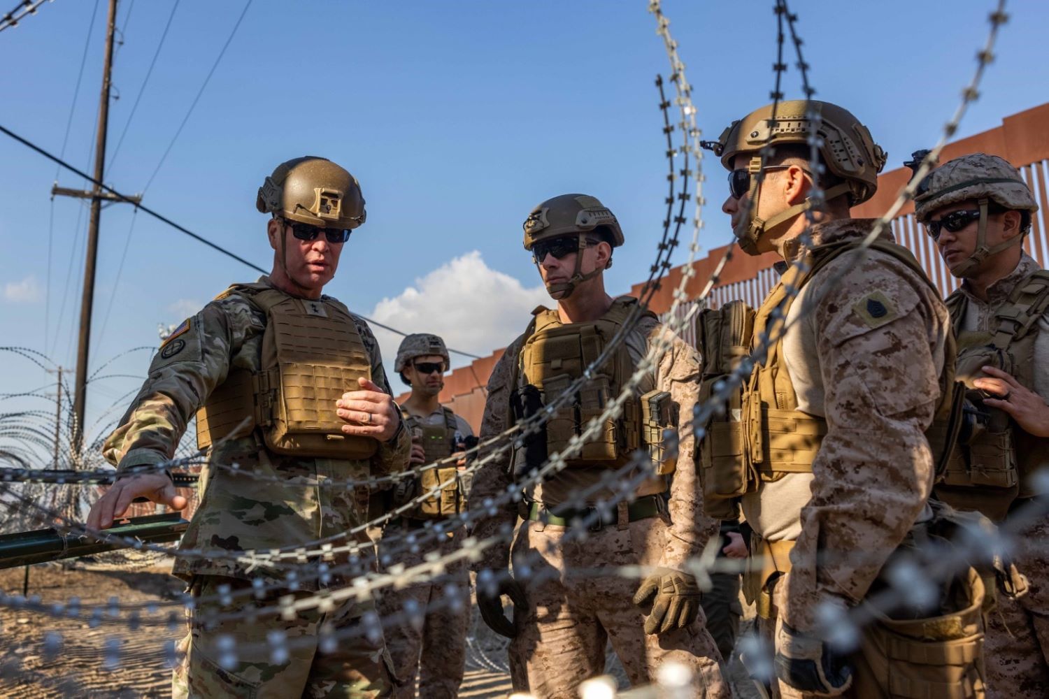 Army Maj. Gen. Henry S. Dixon, commander of Joint Task Force North, is pictured engaging with Marines from the 1st Combat Engineer Battalion