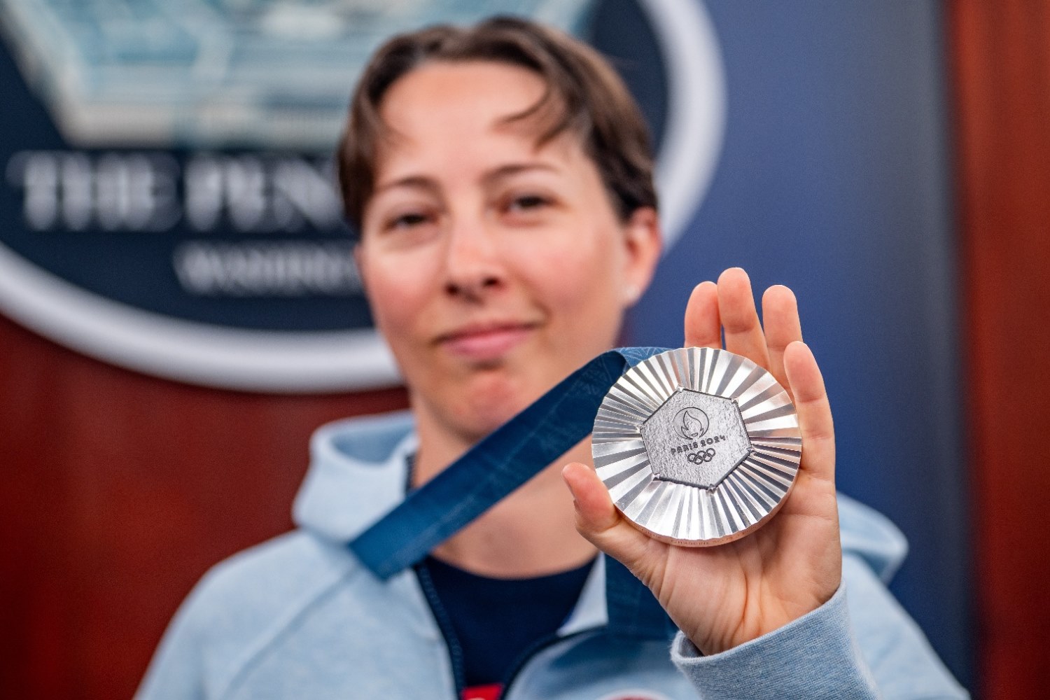 U.S. Army Staff Sgt. Sagen Maddalena proudly displayed her silver medal