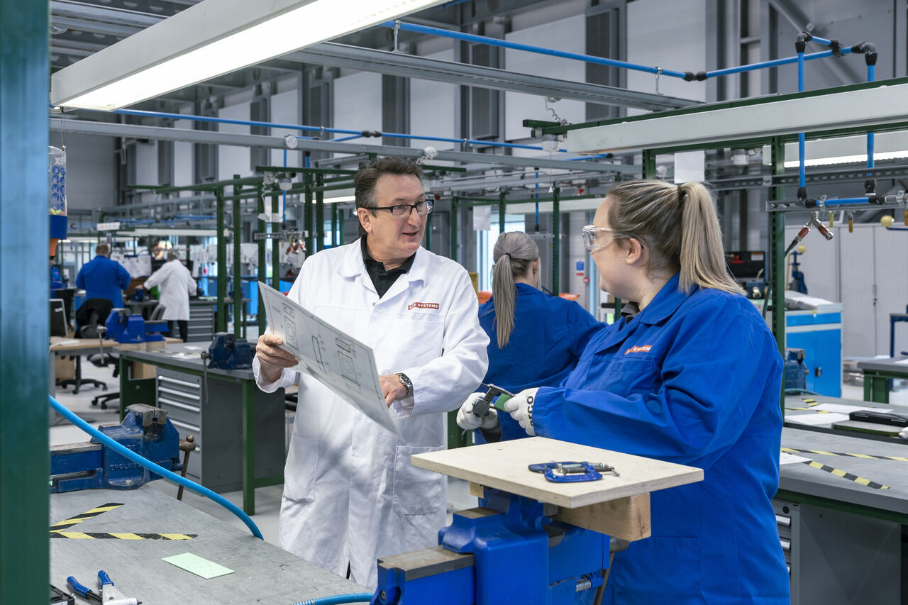 BAE Systems staff collaborate in a manufacture plant