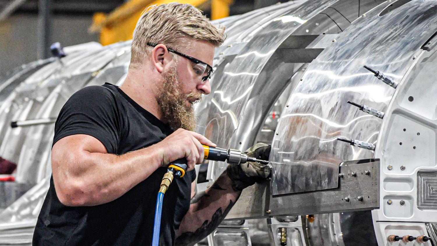 Hermeus engineer work on the engine assembly