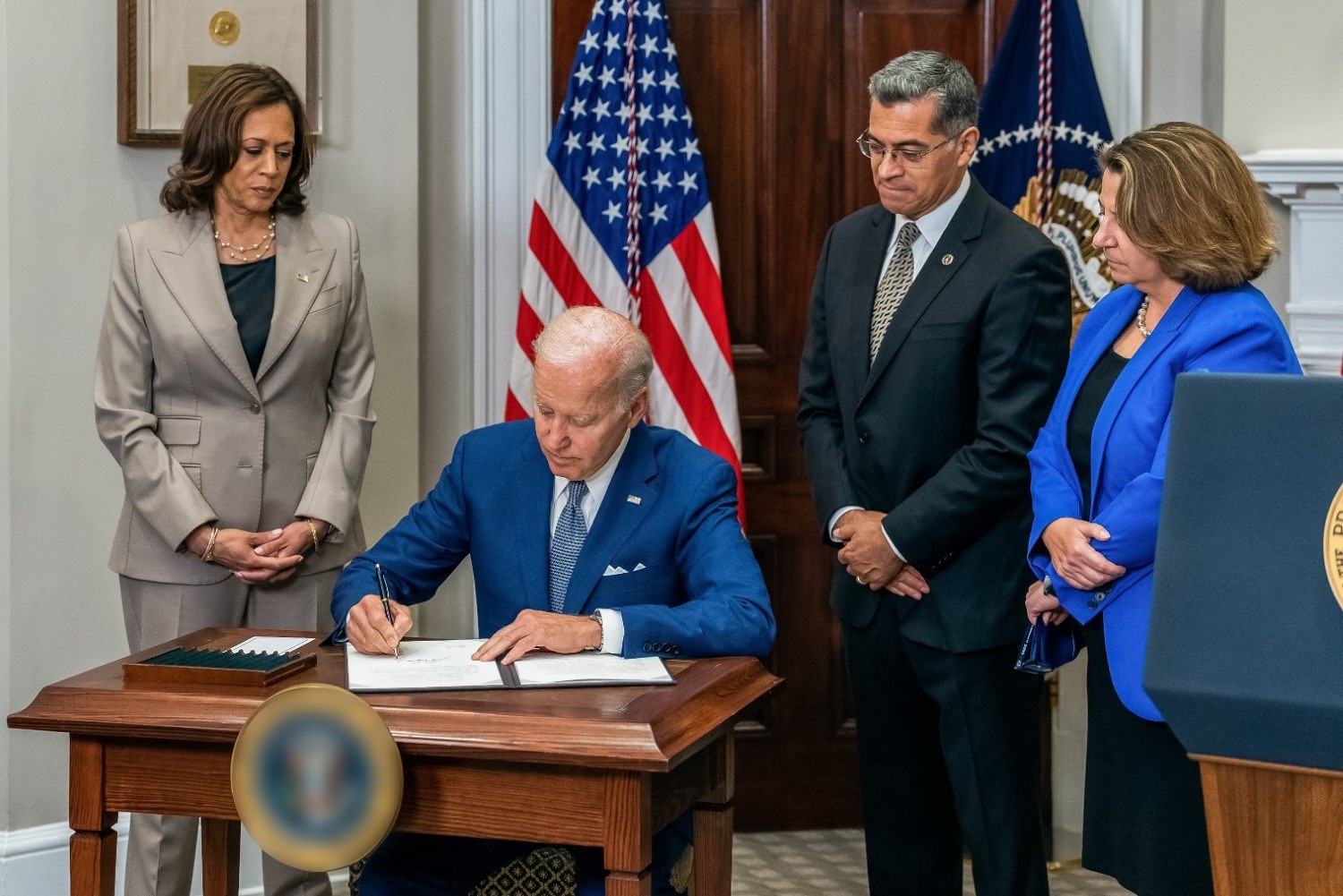 Biden is signing a paper