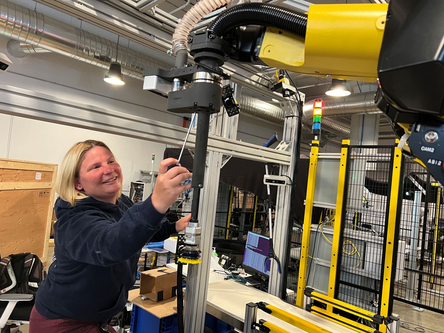 Osaro staff is fixing the robot