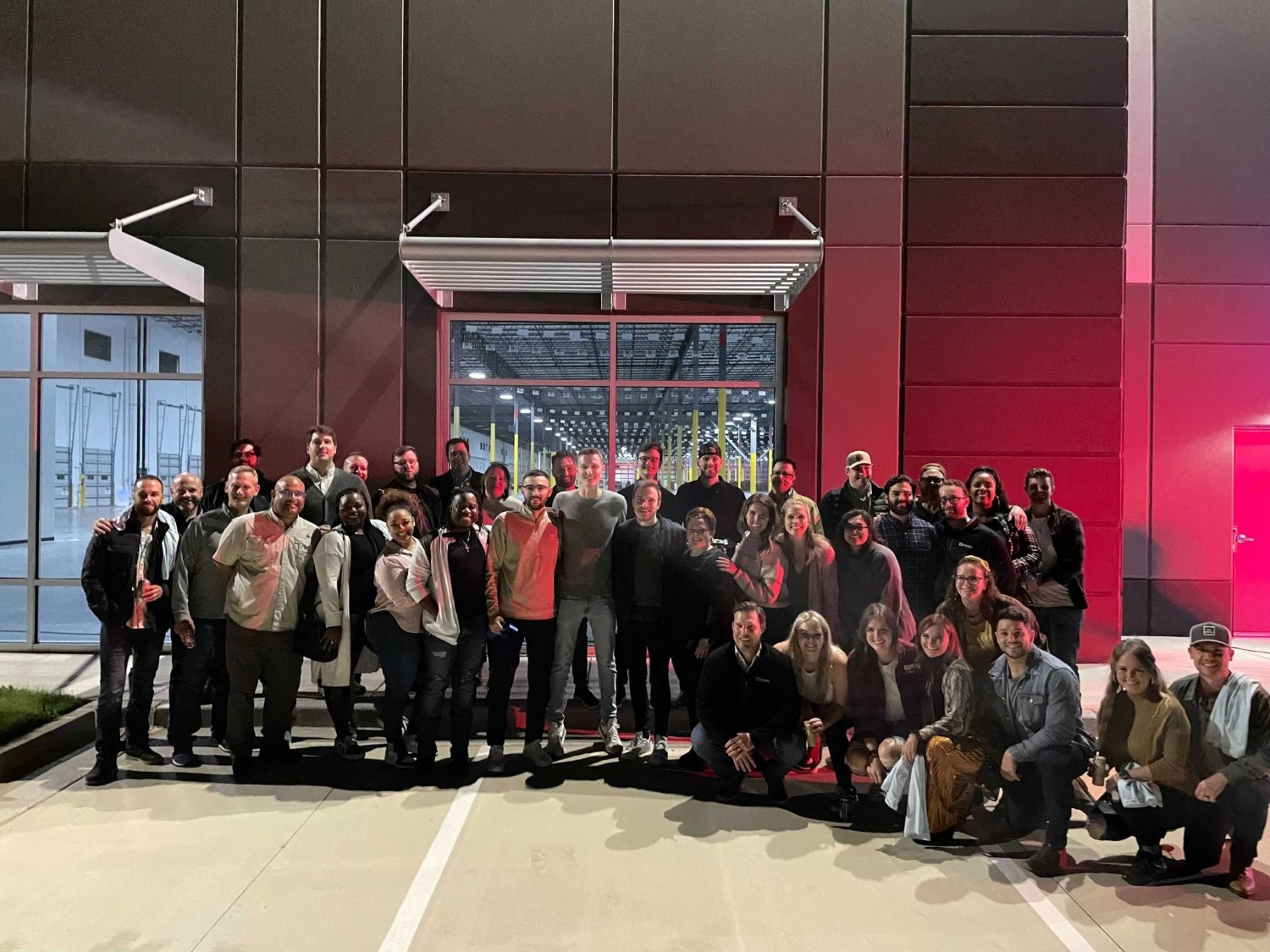 Stord team is taking picture in front of a building