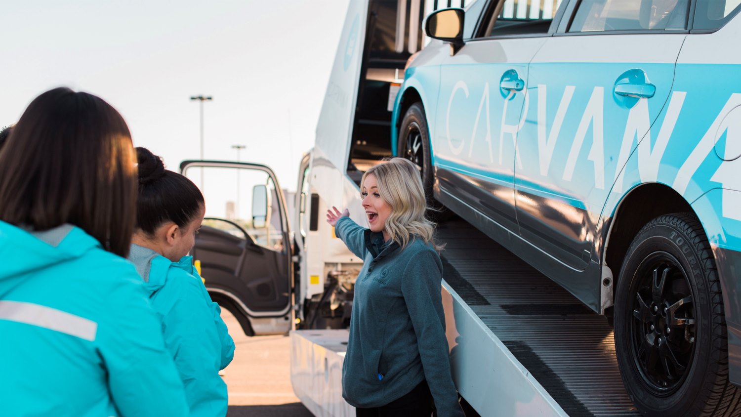 Carvana staff welcome customers
