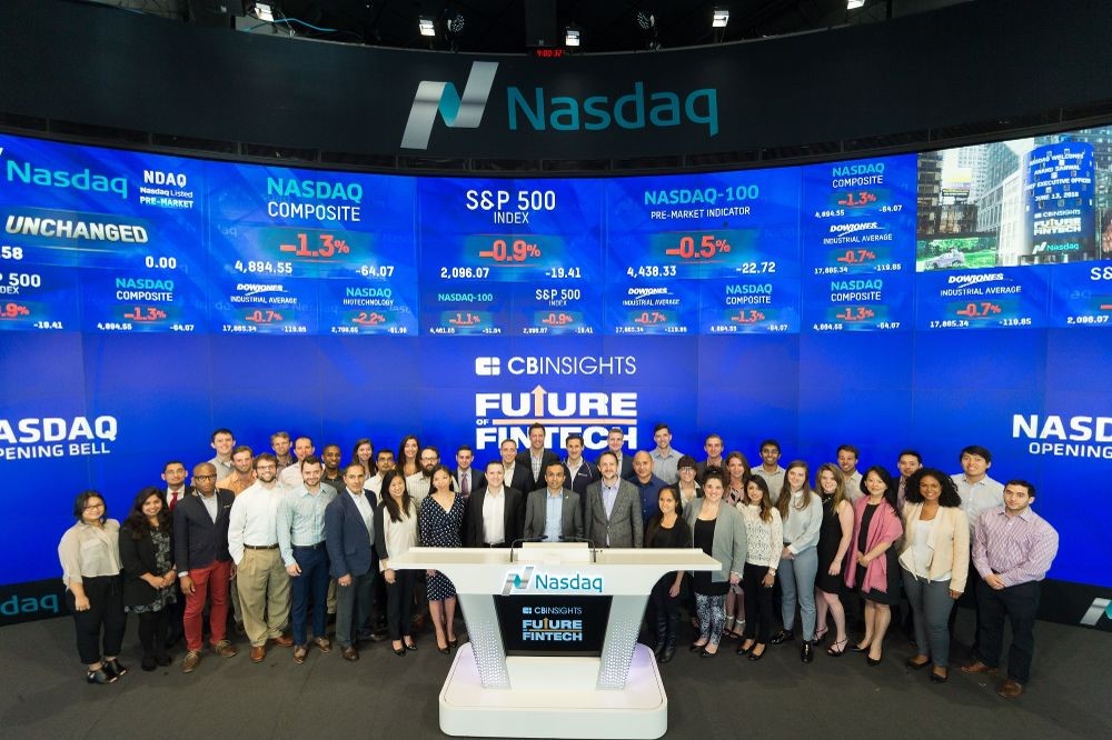 CB Insights staff celebrate with Nasdaq trade platform