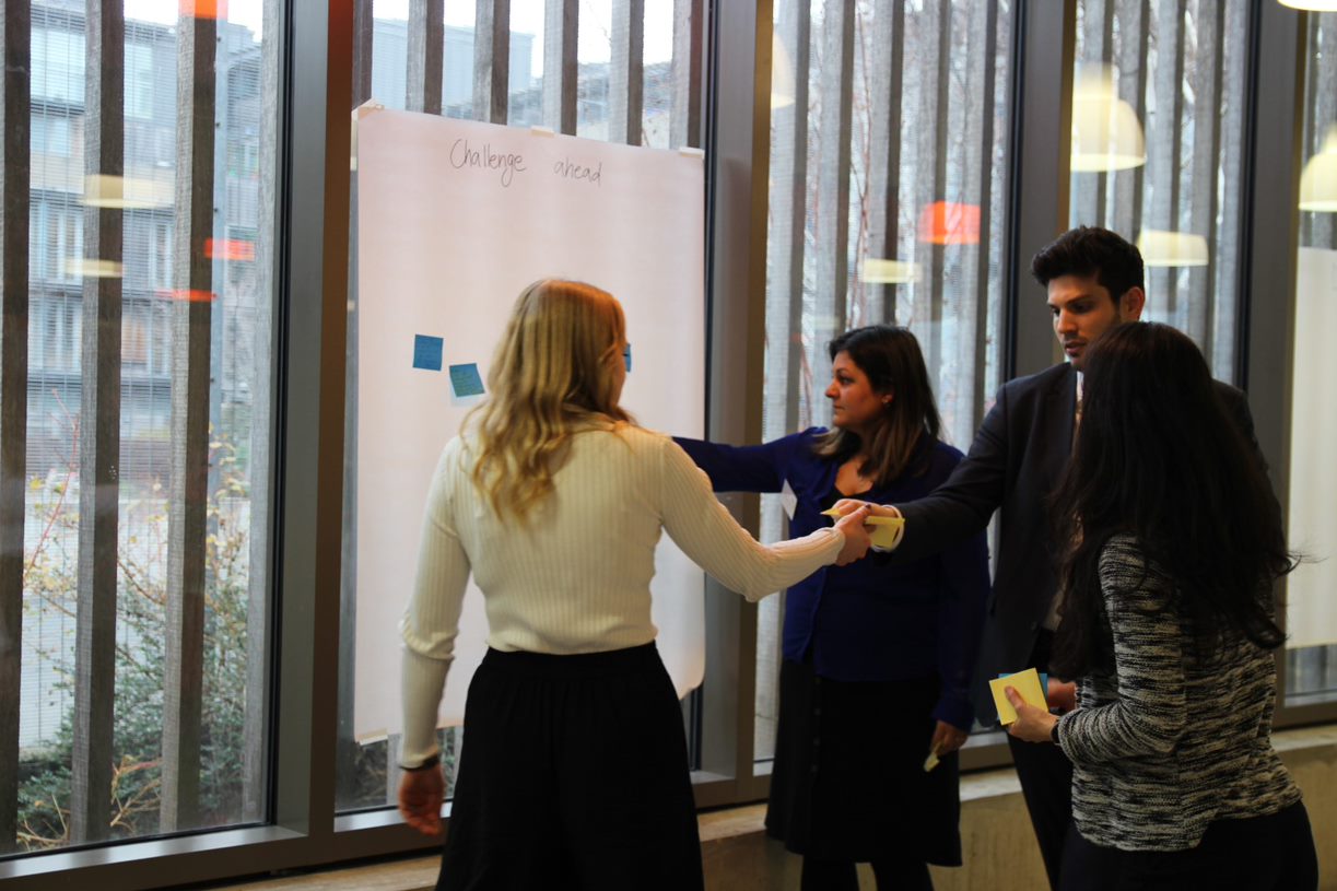 Professionals at tech companies collaborate on projects