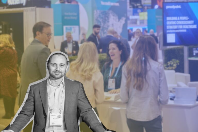ixLayer CEO and the marketing team collaborate at the booth