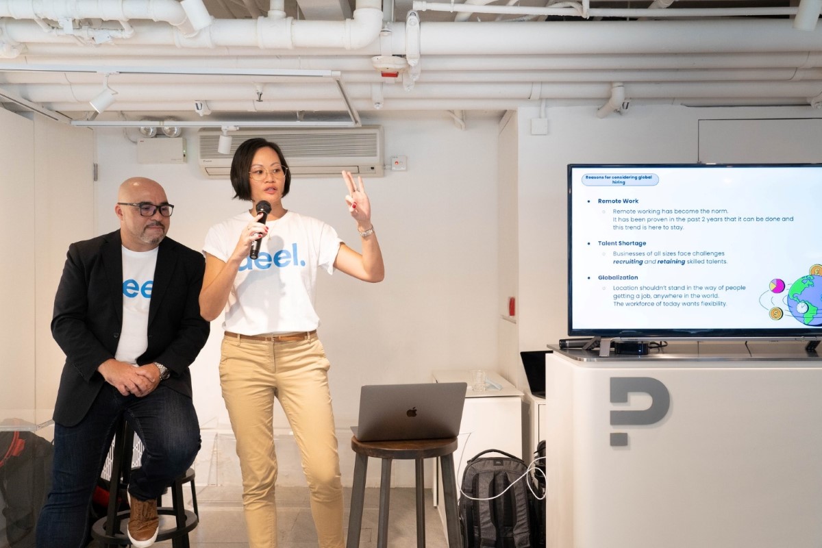 Deel staff present hiring steps at a workshop