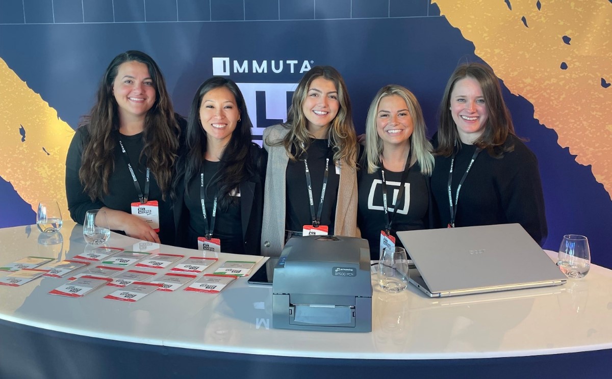 Immuta staff at the frontdesk of Immuta data security conference