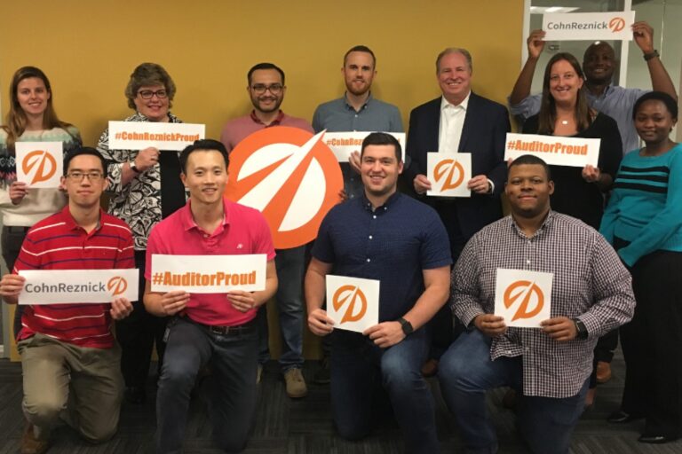 CohnReznick staff celebrate at the office