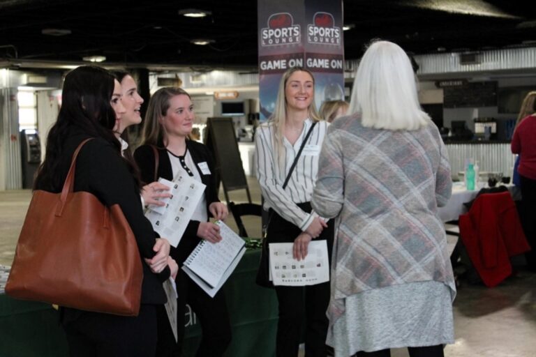 Young professionals collaborate with mentor