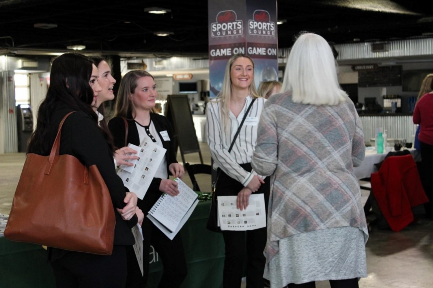 Young professionals collaborate with mentor