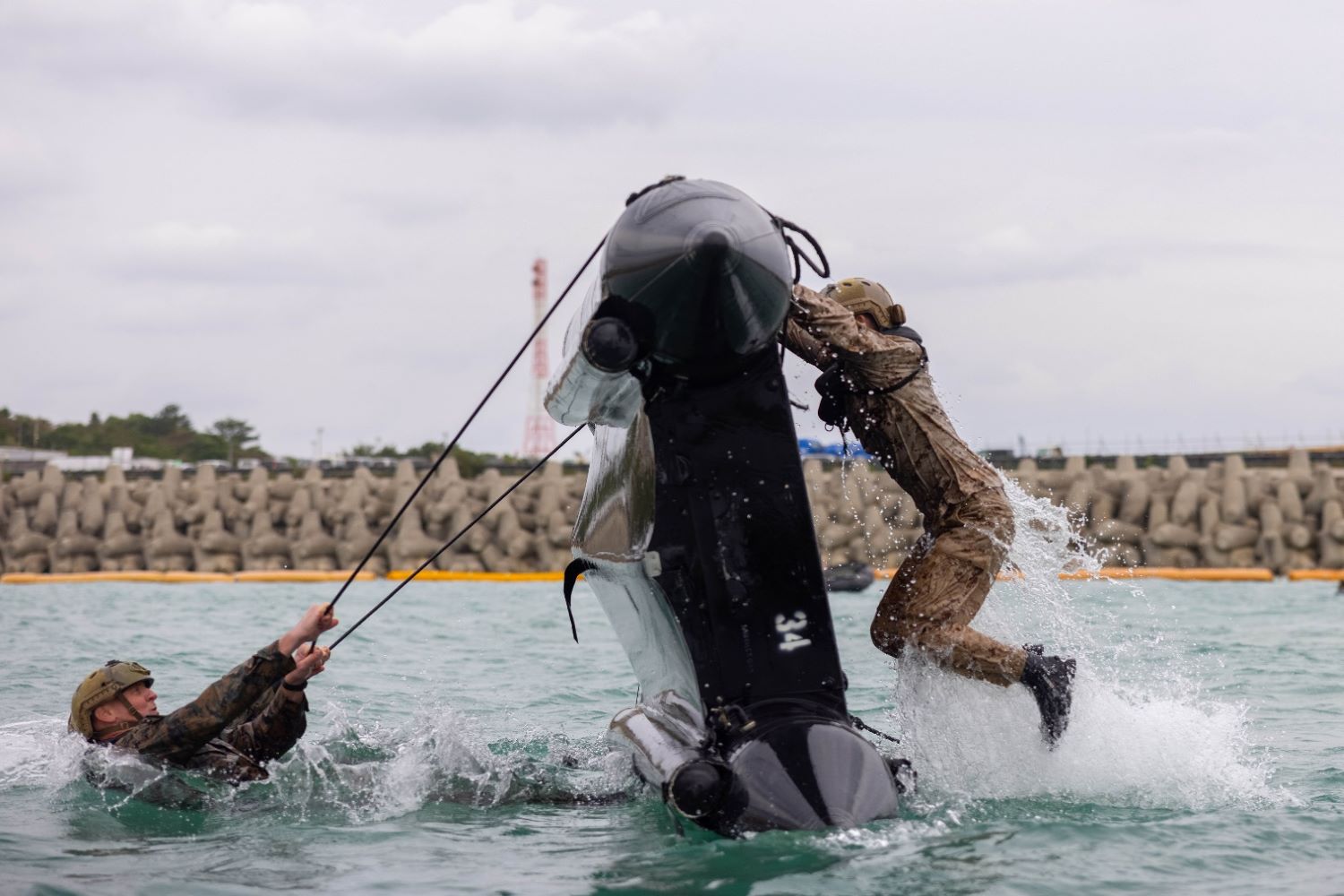 Marines practiced flipping combat rubber raiding craft during small boat training
