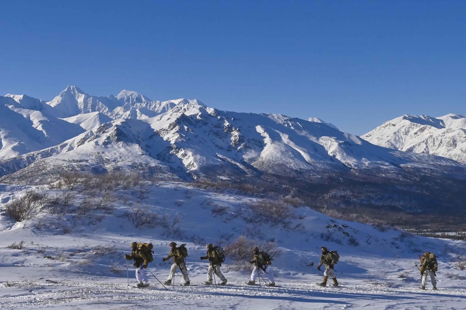 Soldiers engaged in comprehensive avalanche safety training during a cold weather