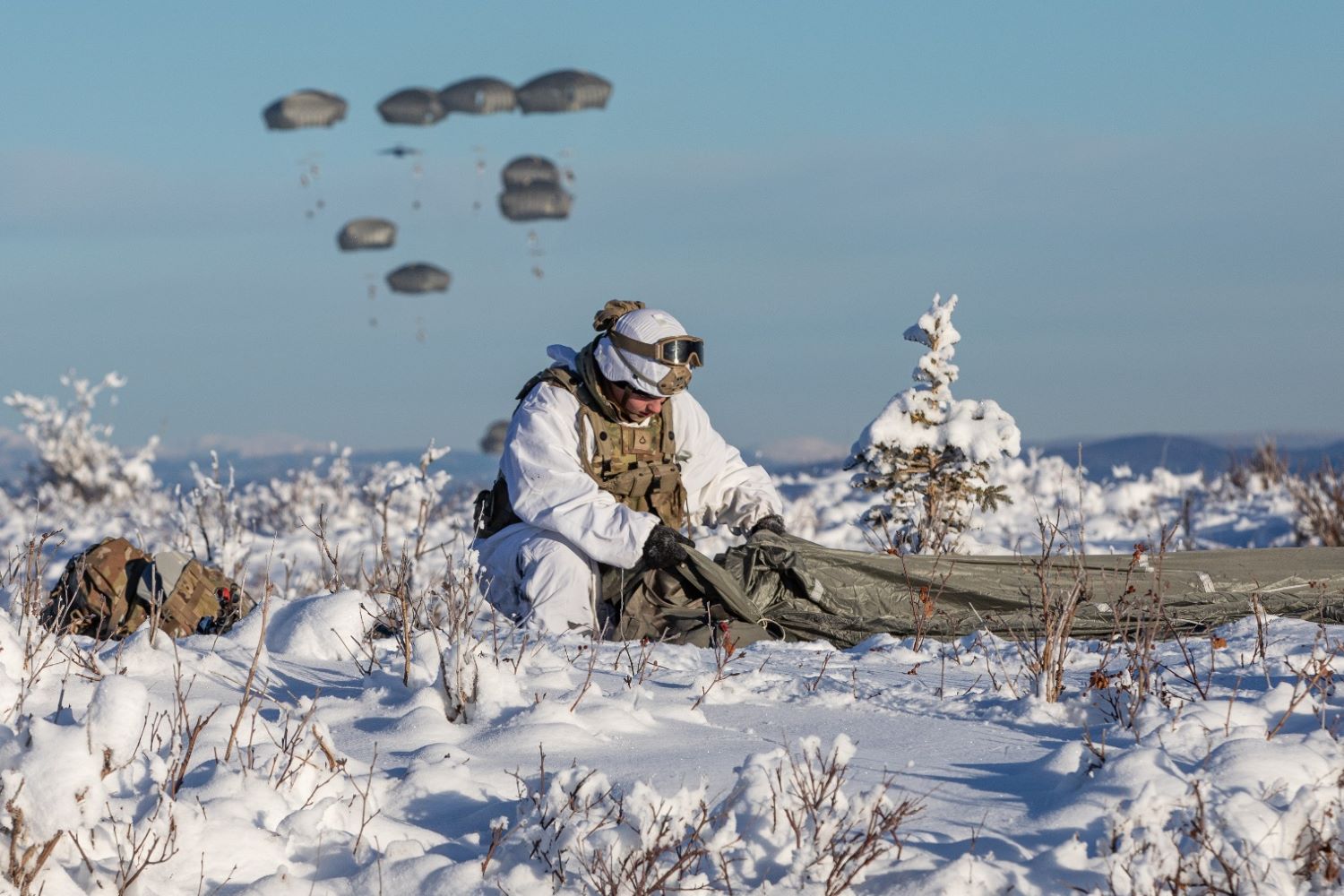 A soldier recovered his parachute after jumping onto Donnelly Drop Zone
