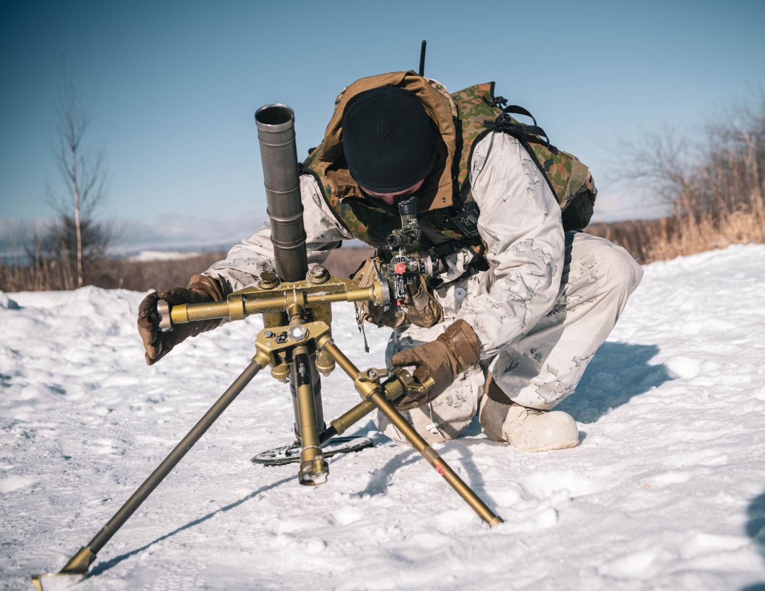 A soldier set up a 60 mm mortar system