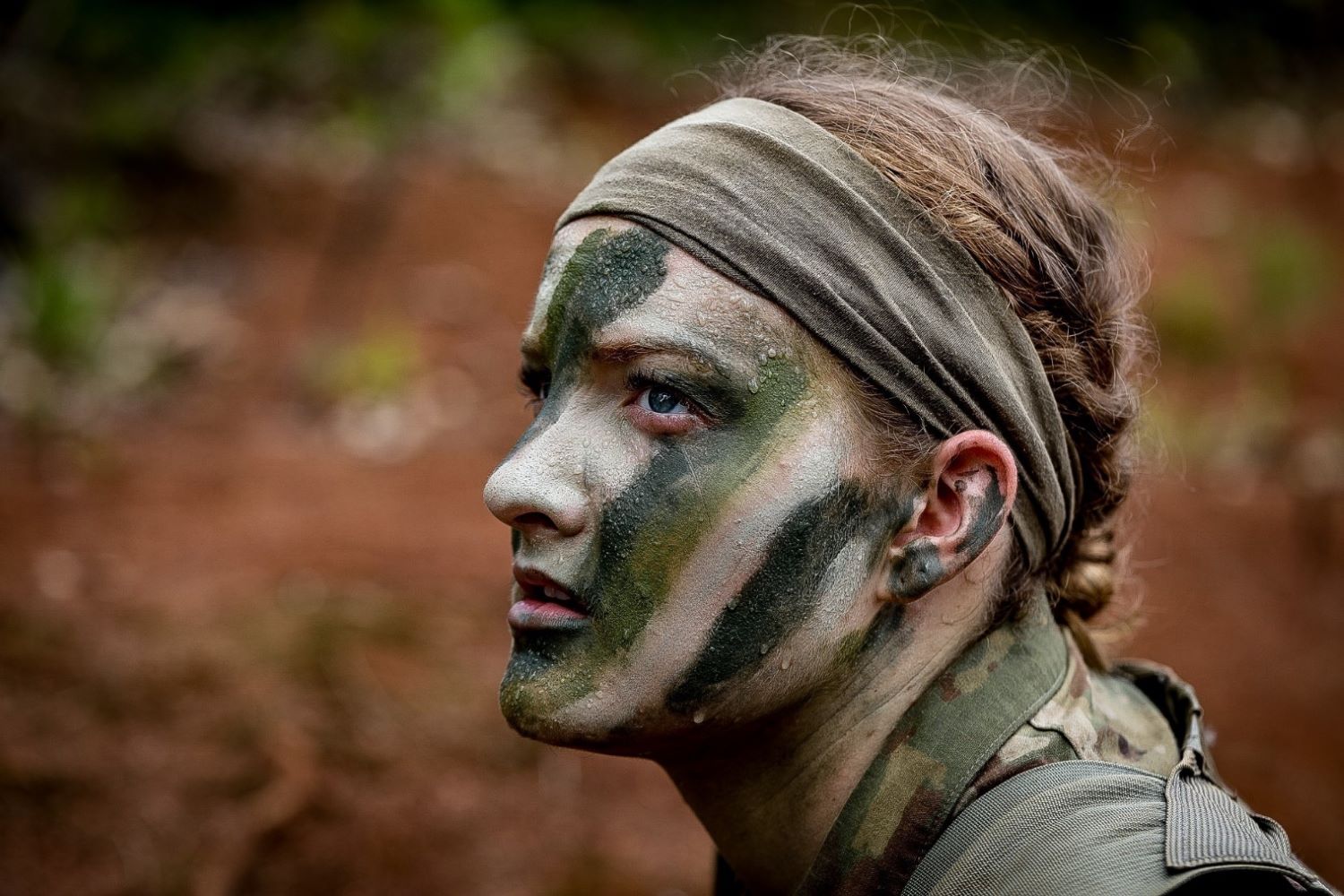 face painted with camouflage patterns