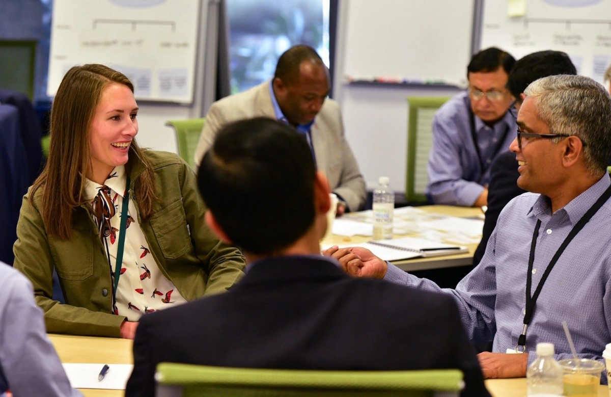 Deloitte staff collaborate in a training session