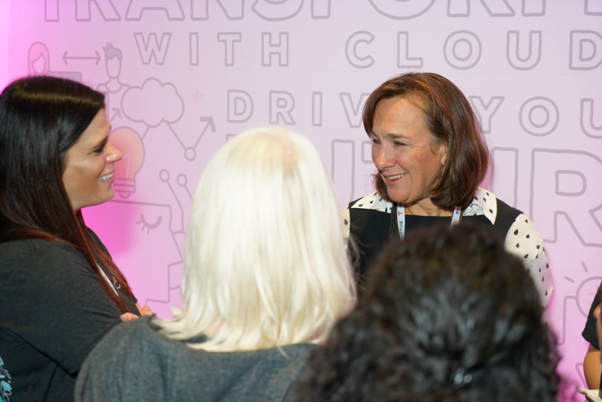 Deloitte staff in a tech conference