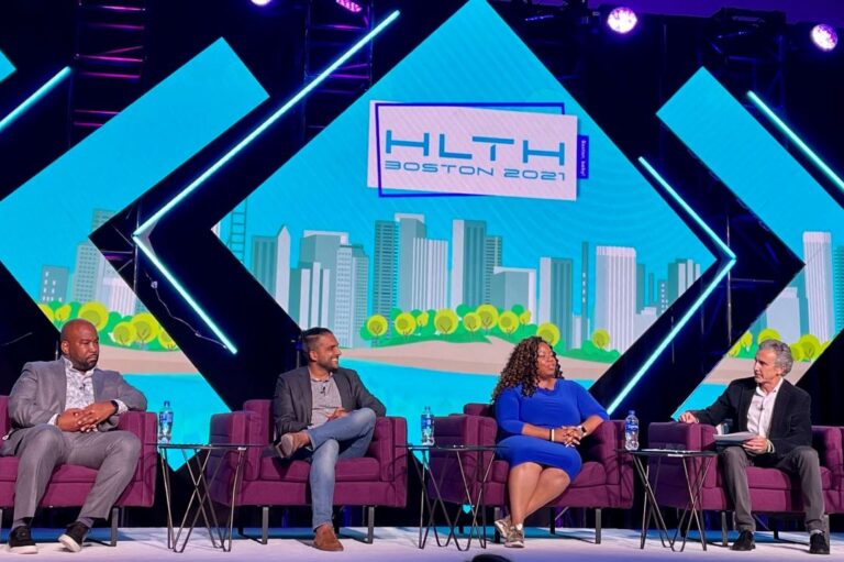 Komodo Health speaks on stage at HLTH Boston conference