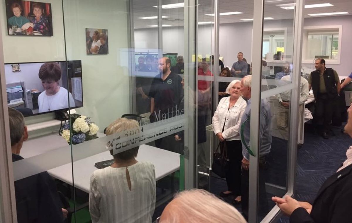 E.M Duggan staff in a conference with leadership team