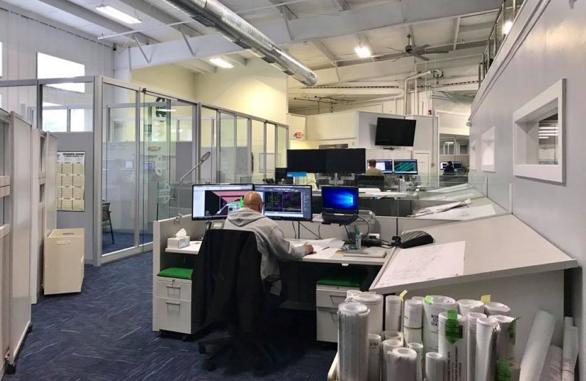 E.M Duggan engineers work on drawings