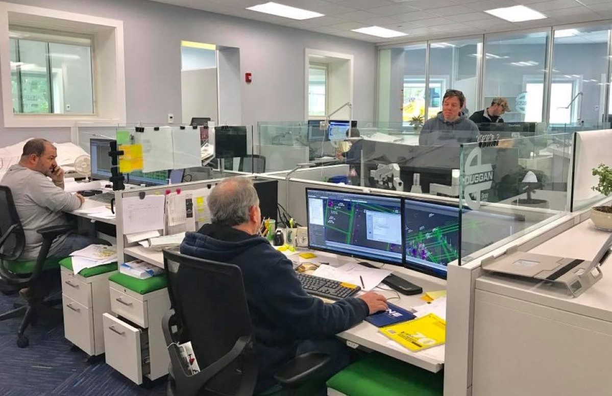 E.M Duggan designer inspect floor plan drawings