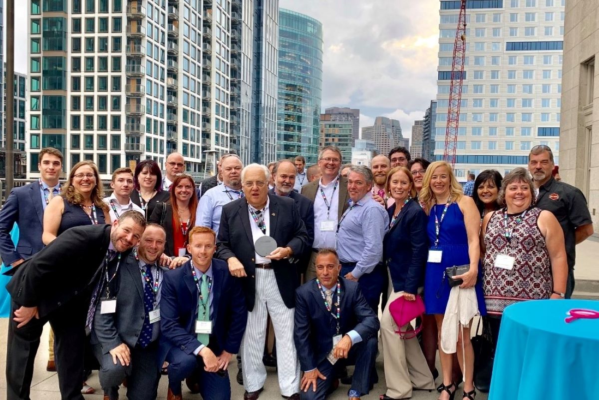 E.M Duggan leadership in a social event with client