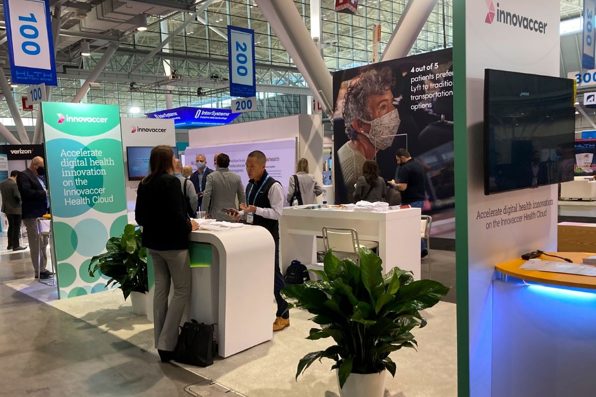 Innovaccer staff collaborate with attendees at conference