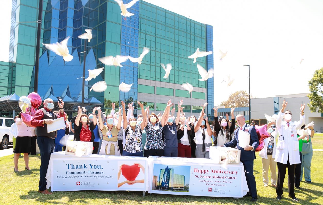 Prime Healthcare leadership team in a ribbon cutting ceremony