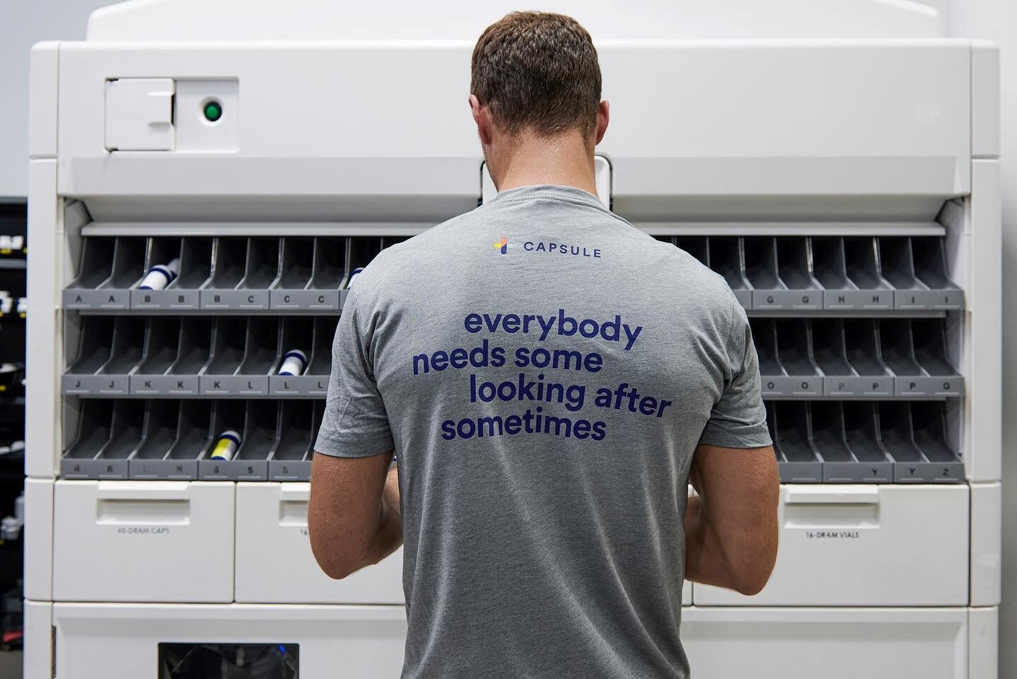 Capsule staff inspect the prescription dispensers