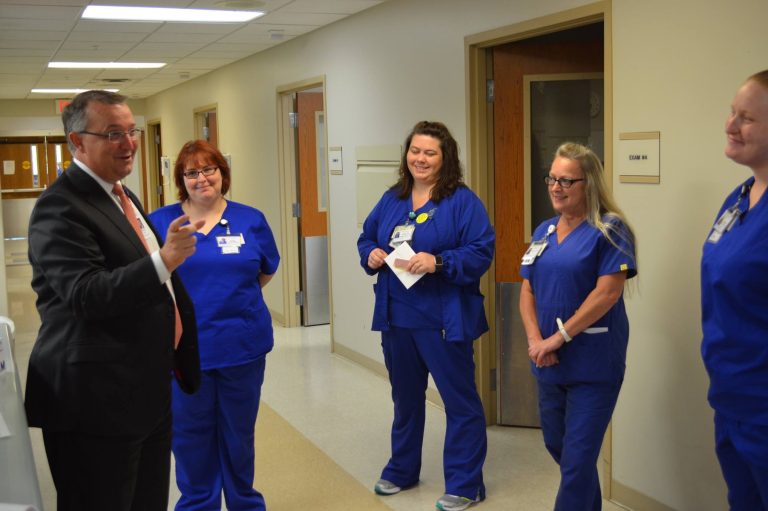 LifePoint Health CEO collaborate with staff at a hospital