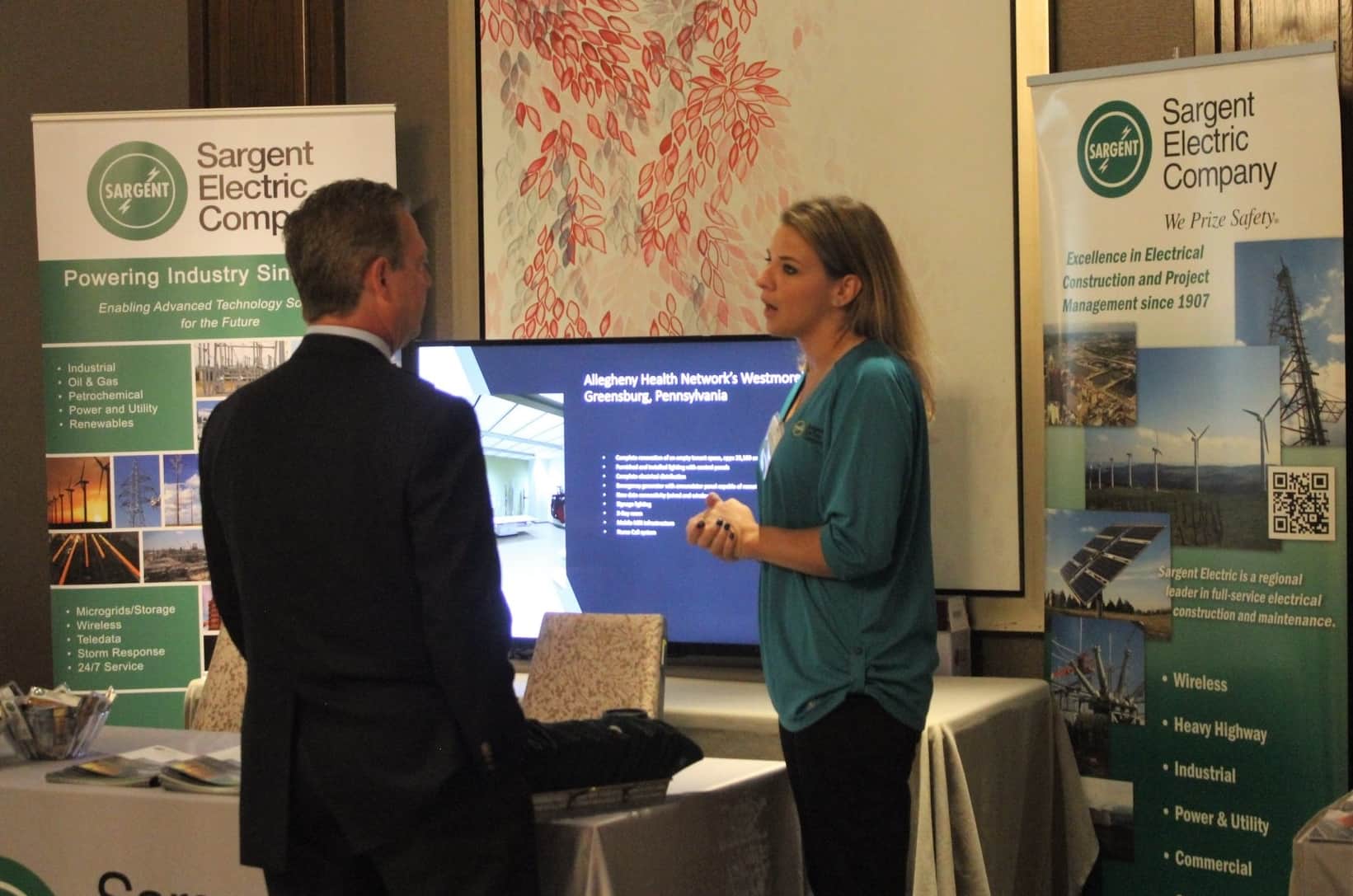 Sargent Electric staff talk to attendees at the conference