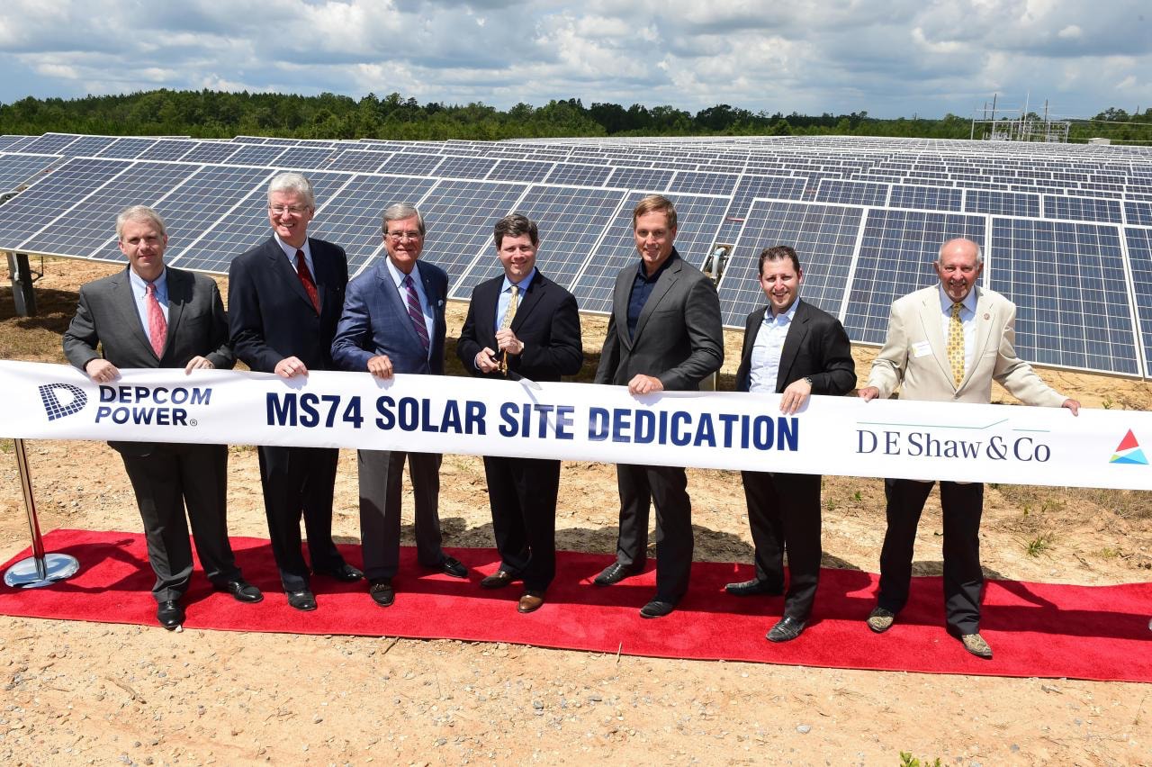 DEPCOM Power leadership at a ribbon cutting ceremony at solar farm