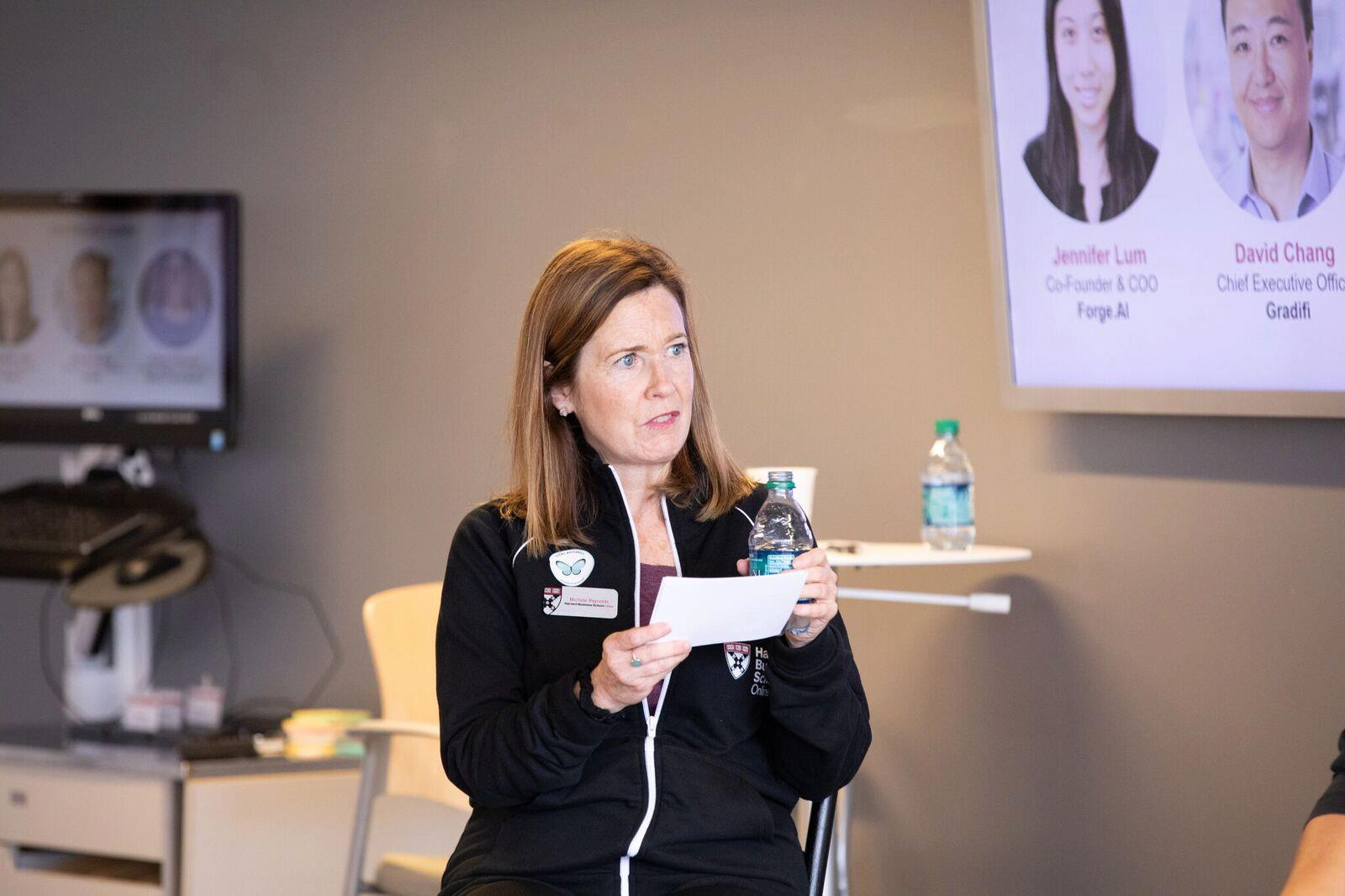 Harvard Business School staff in an interview with CEOs at a workshop