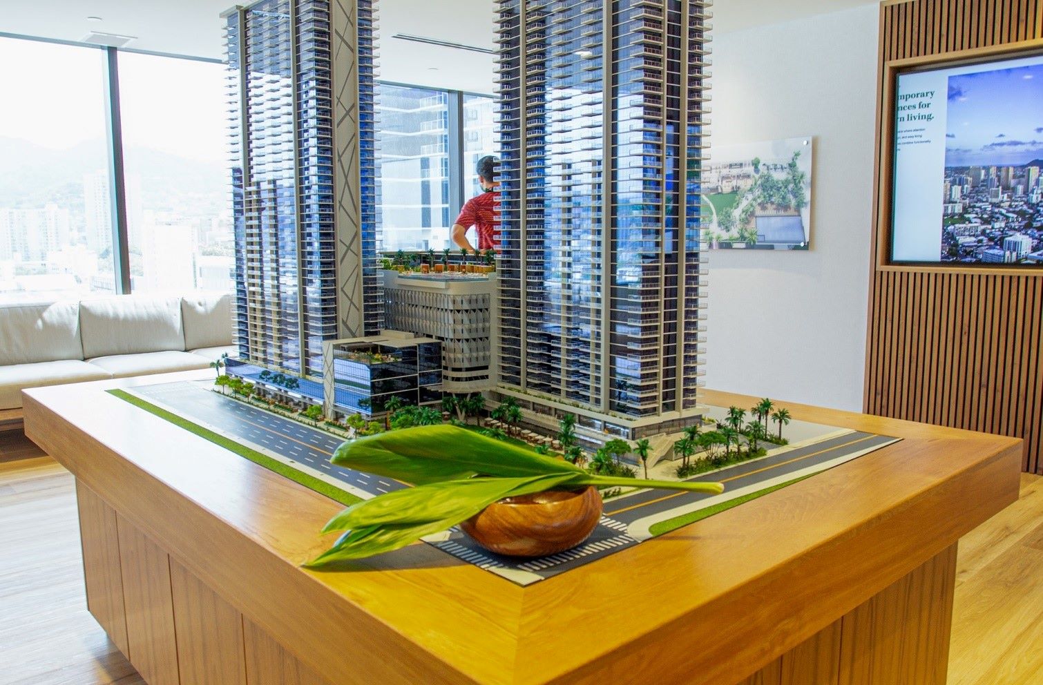 staff work on a model of complex building in Hawaii downtown