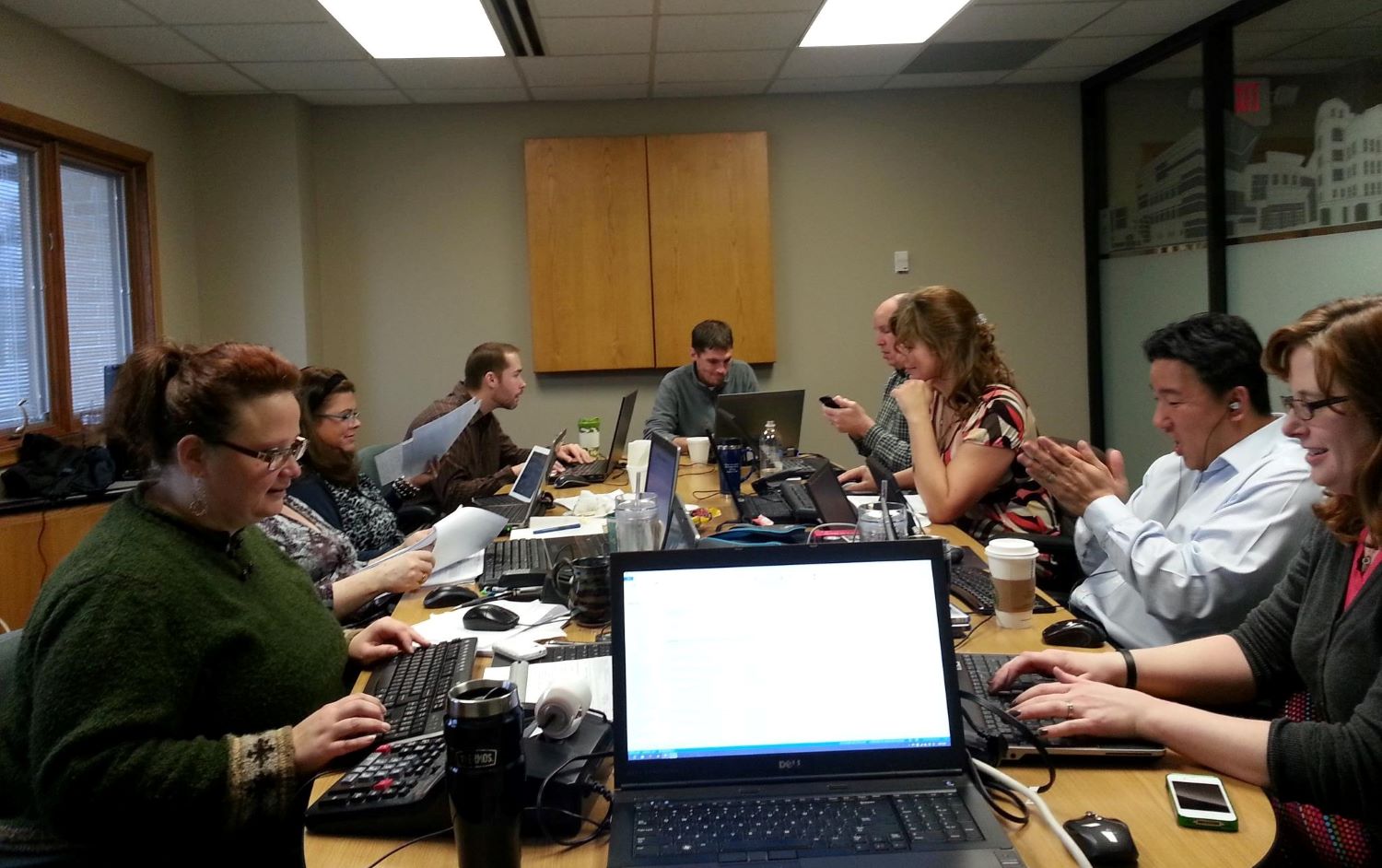 Granger Construction collaborate in a meeting