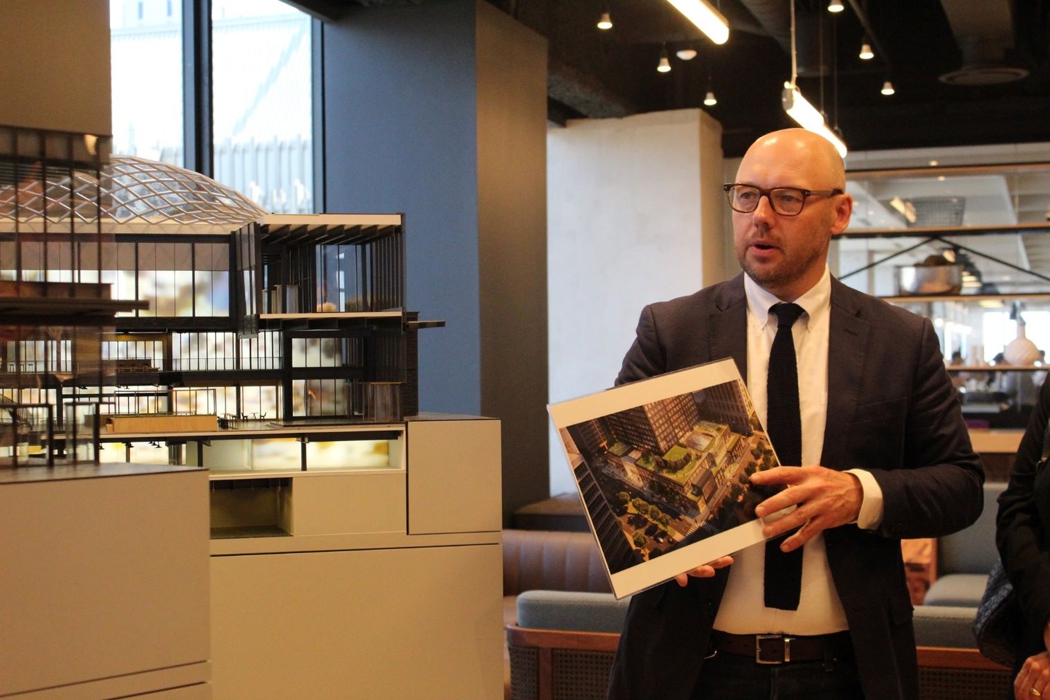 Gensler architect present to clients of the building model