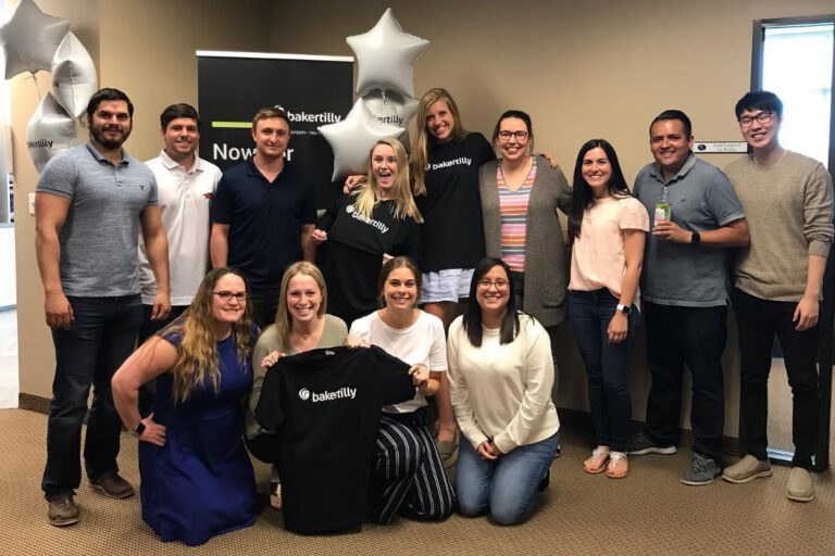 Baker Tilly team celebrate at the head office