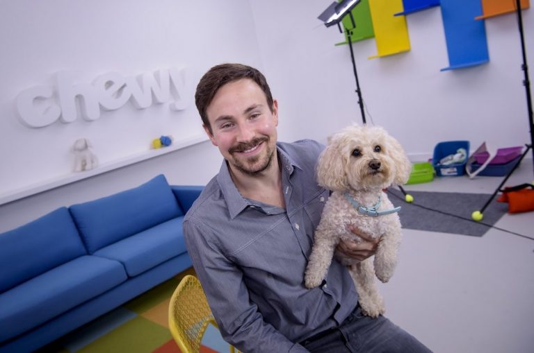 Chewy CEO in a photoshoot with pet