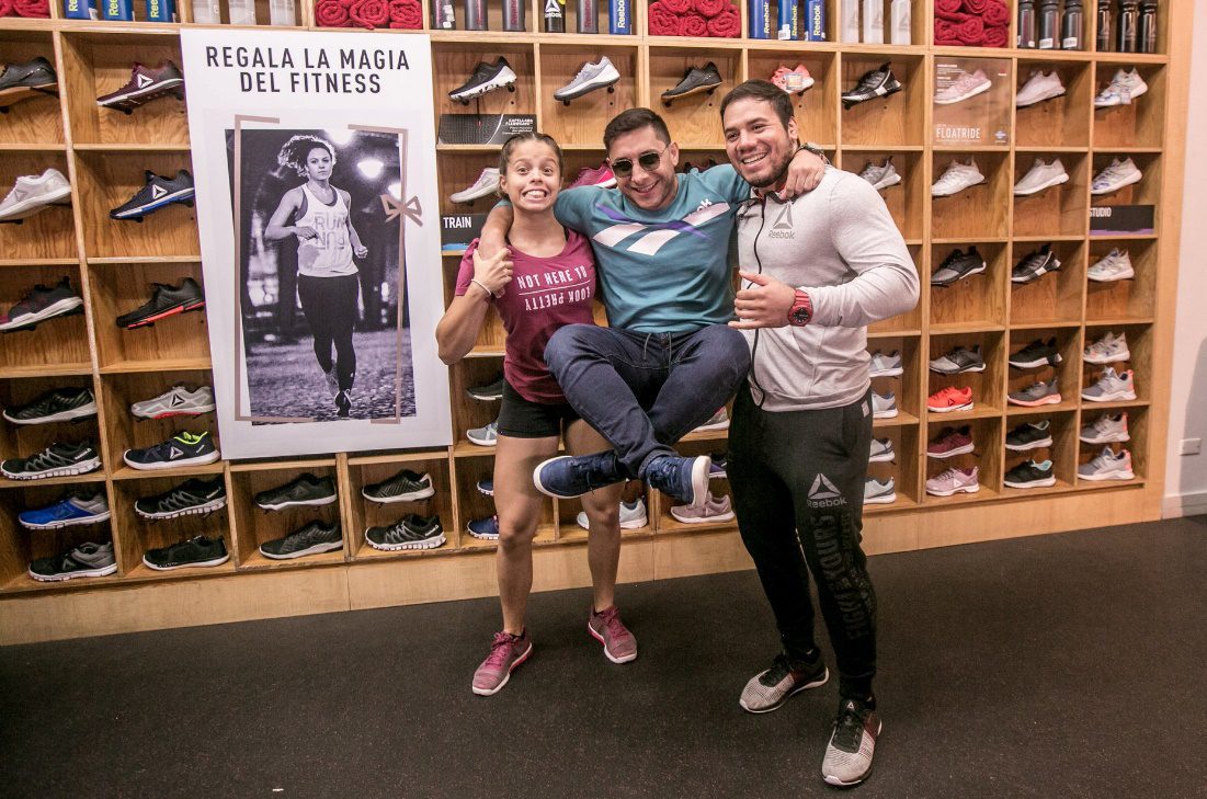 Reebok staff with customers in a store