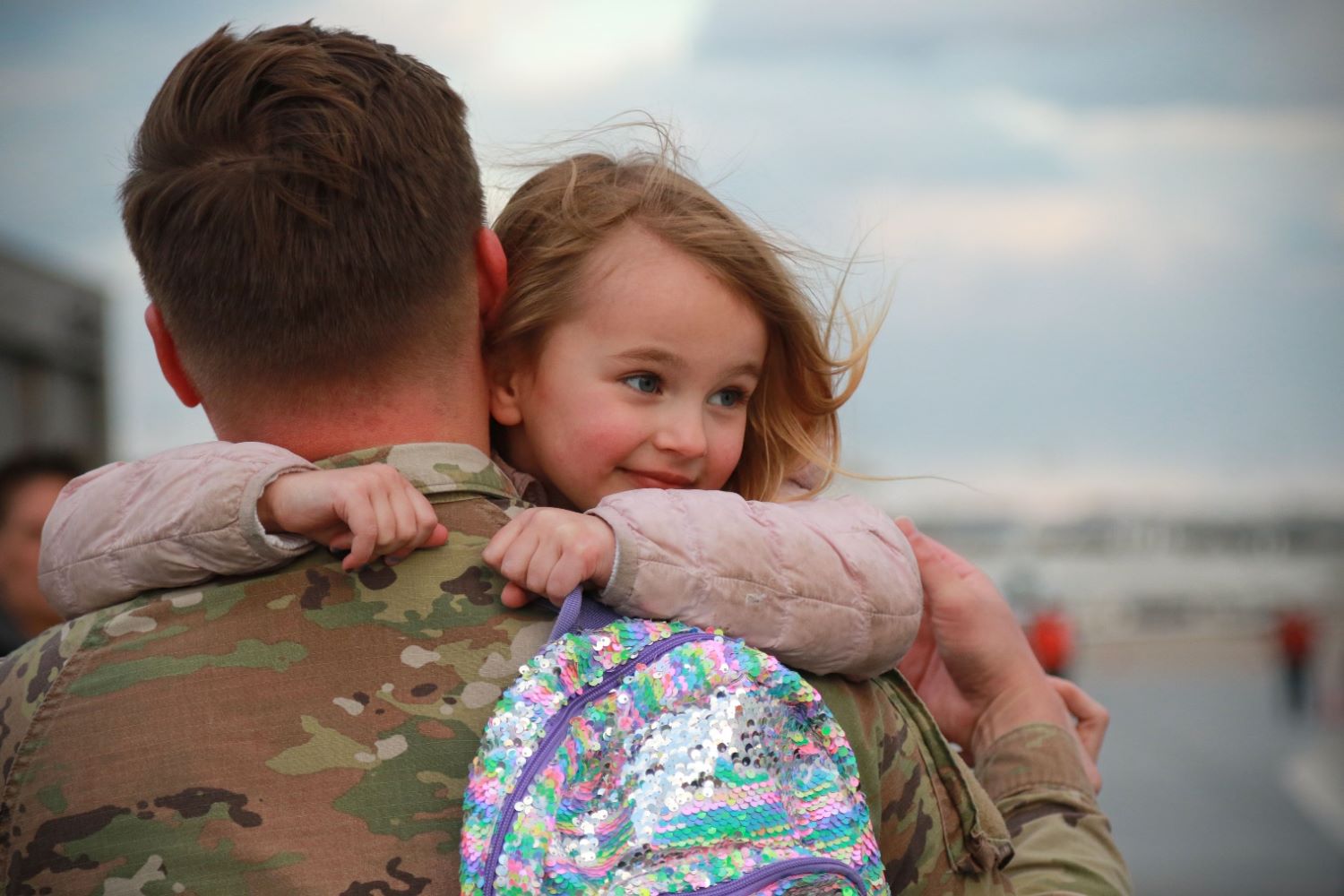 a soldier's holding his child