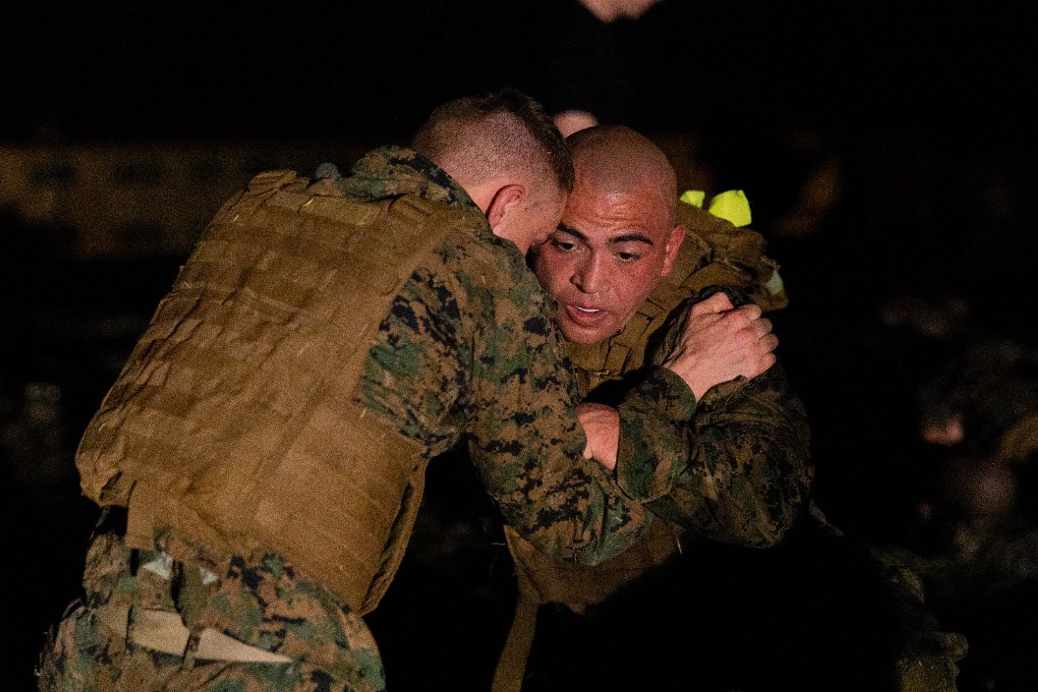 Lance Corporal Tanner Angiletta of the U.S. Marine Corps, seen on the right, participates in a hand-to-hand combat exercise
