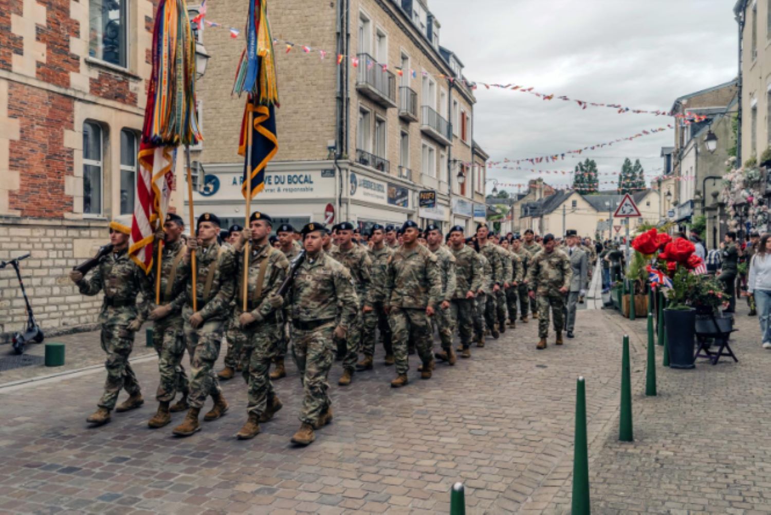 U.S. Army soldiers from the 101st Airborne Division march in solemn formation