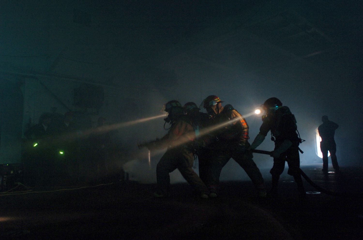 A fire fighting team operated in darkness to extinguish a mock blaze